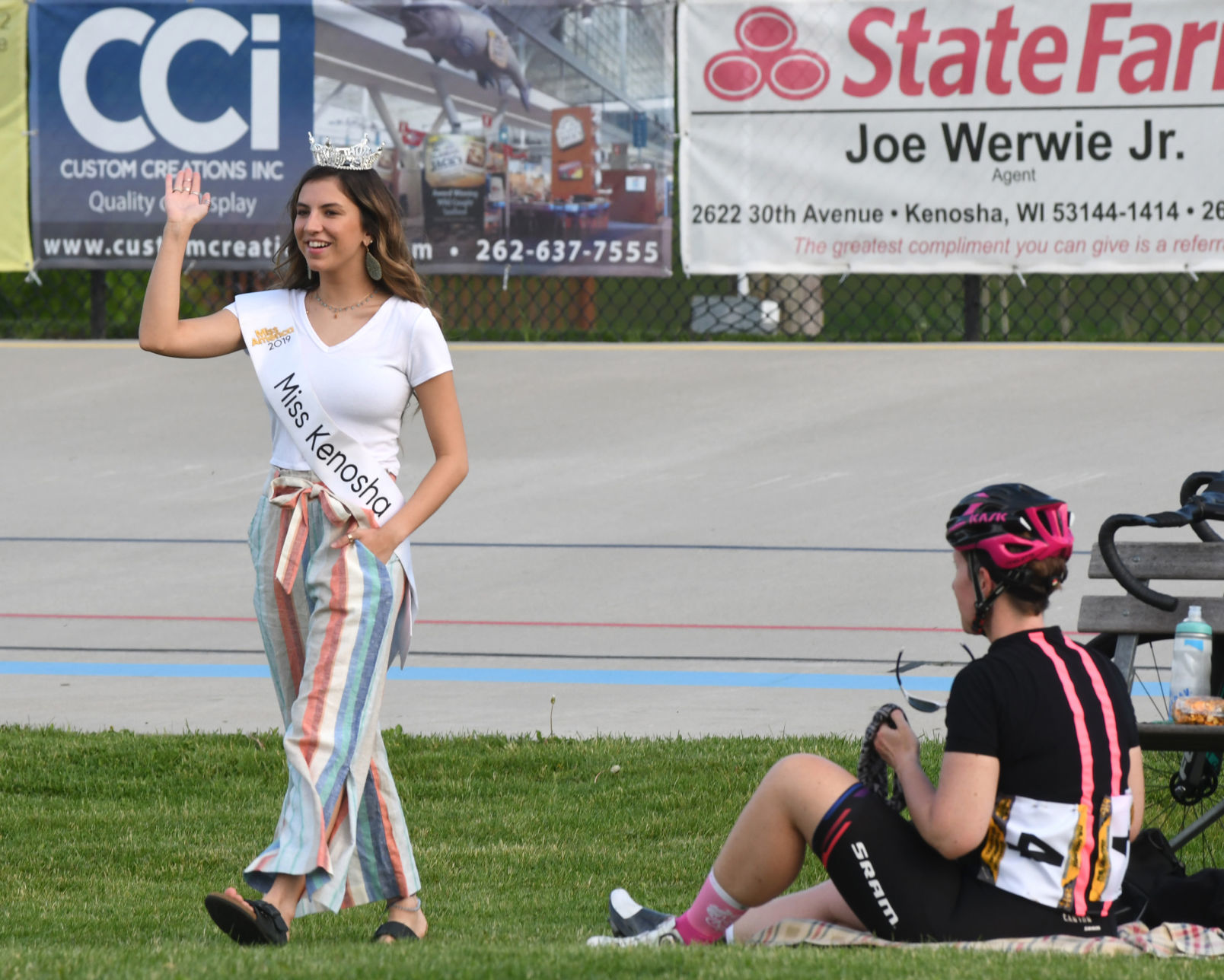 Lily Karnes Miss Kenosha waves at bike races.jpg